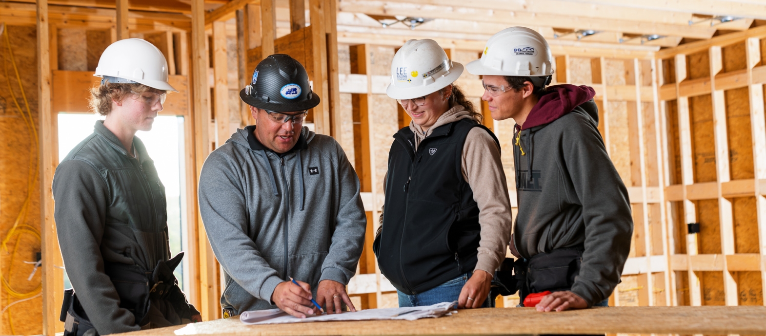 SCC Construction program instructor and students